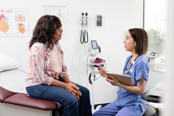 Woman talking to doctor