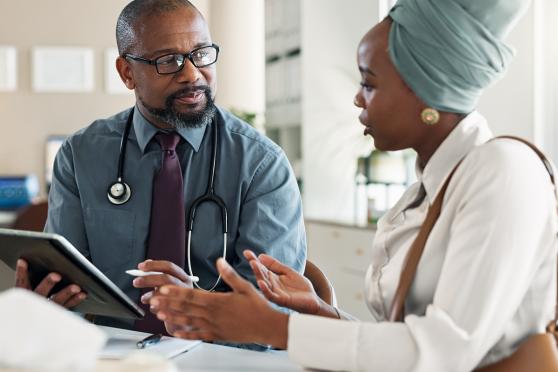 Woman talking to doctor